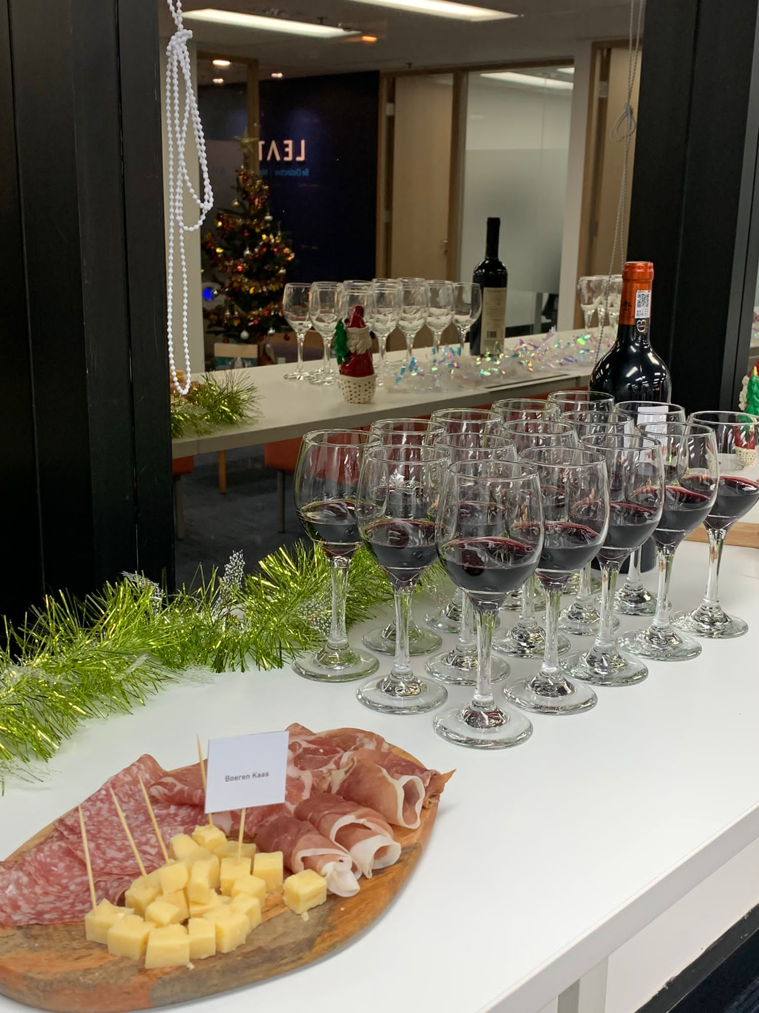 Image of charcuterie board and wine glasses on a table