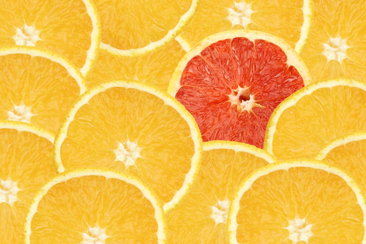 orange slices with a red orange slice standing out