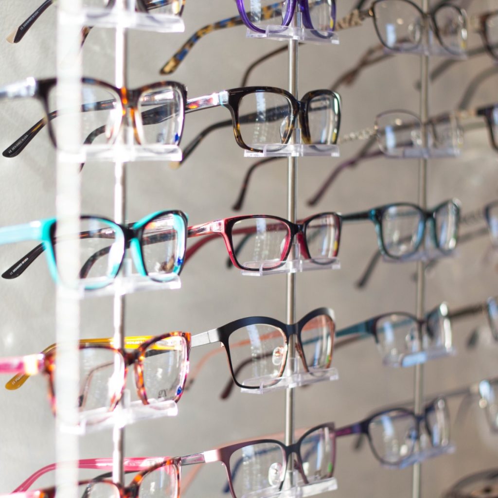 Image of eye glasses on stalls in a shop