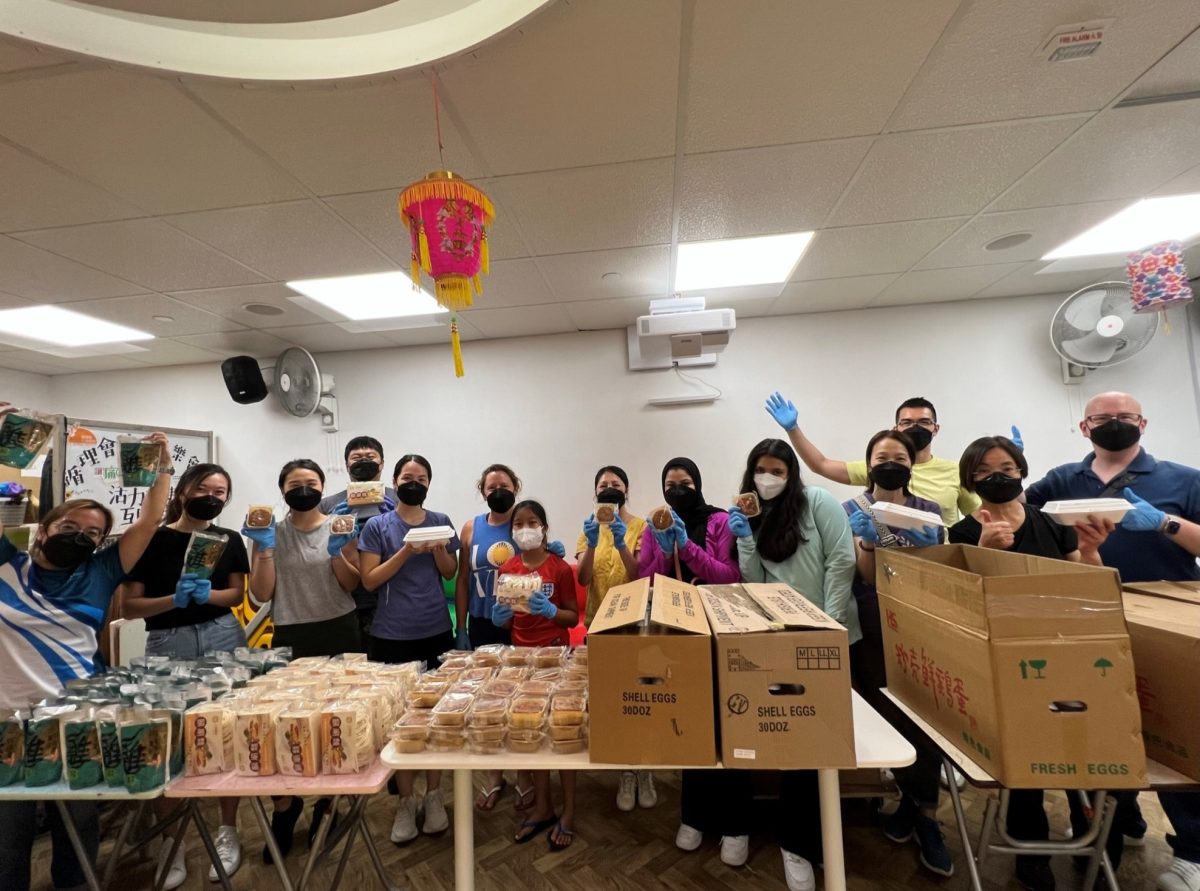 Photo of a dozen Leathwaite volunteers with all the food being ready to delivered to the elderly for Against elderly abuse