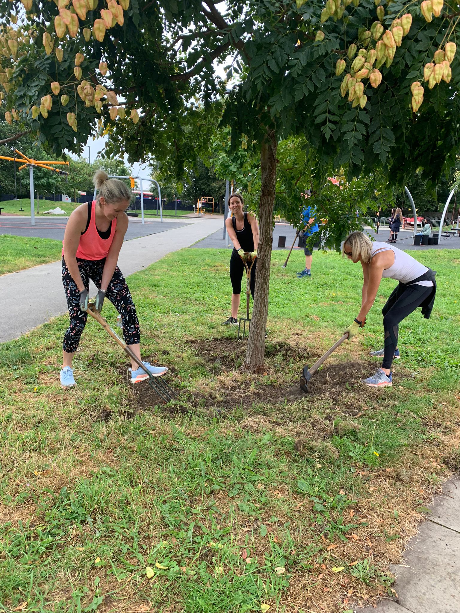 Image of three Leathwaite employees planting a tree