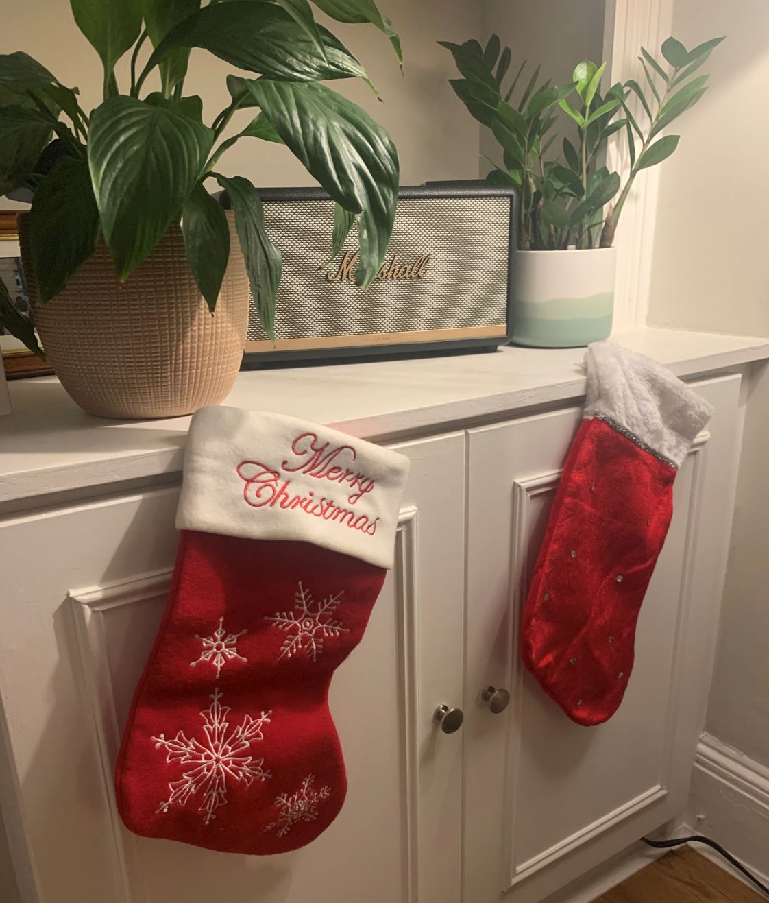 A photo of 2 Christmas Socks hanging in the home of Rosie Gibson.