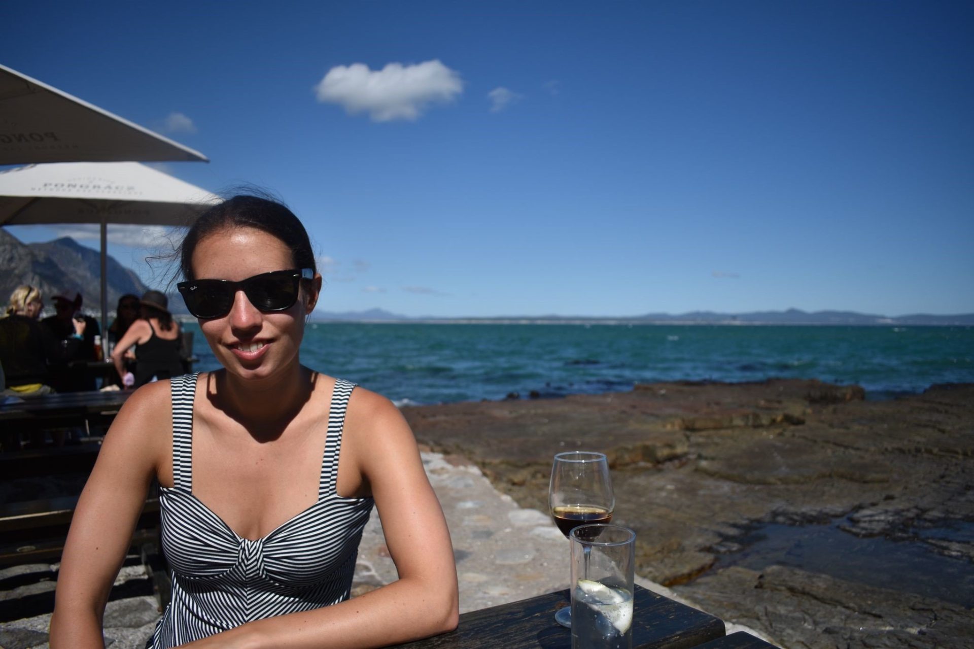 Photo of Rosie Gibson next to the sea in South Africa