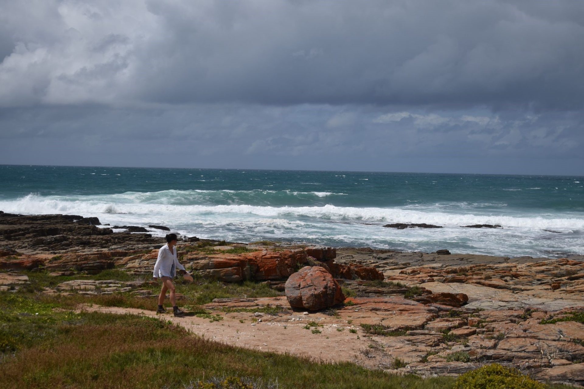 Photo of Rosie Gibson next to the sea in South Africa.