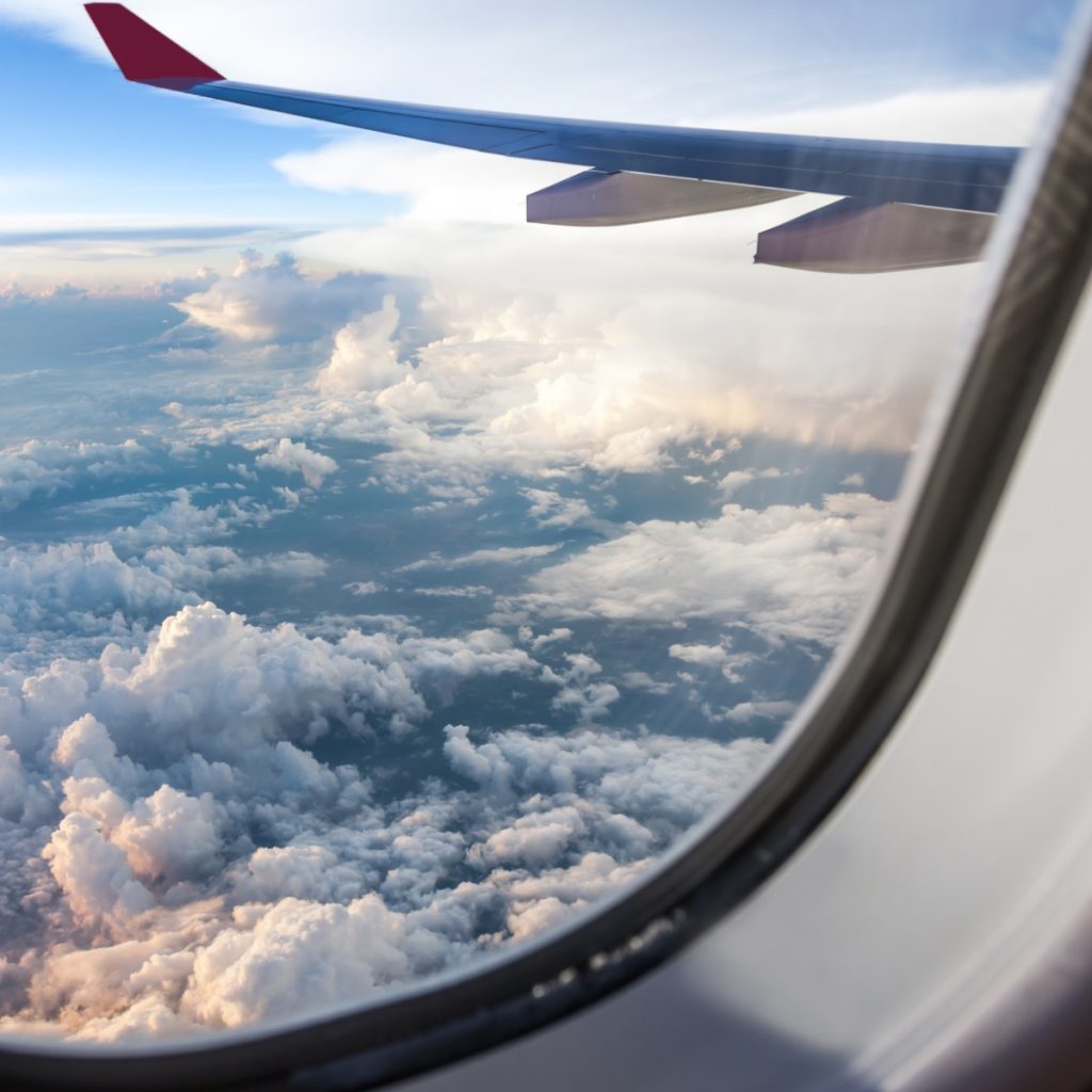 Cloudy sky seen from plane window