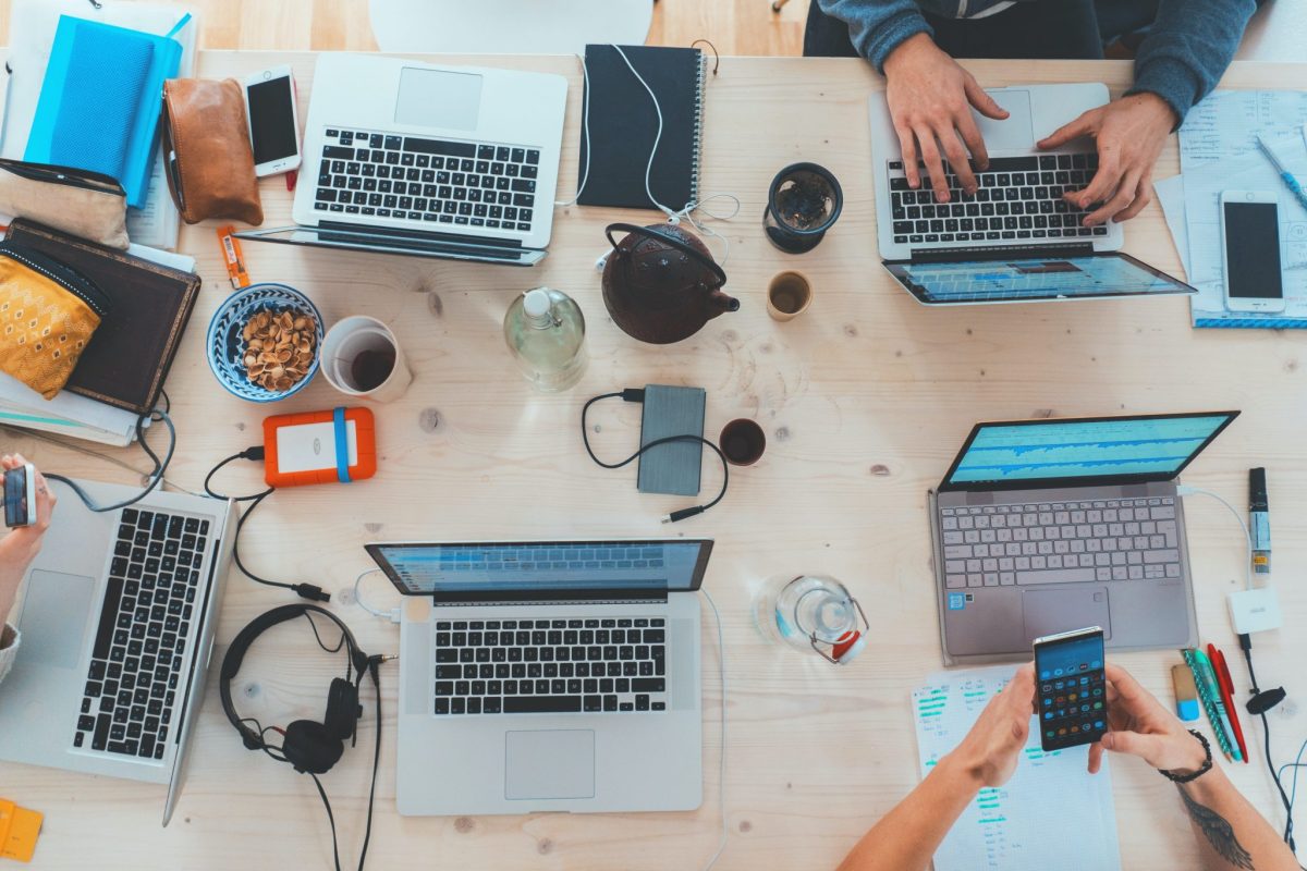 Image of people working on laptops.