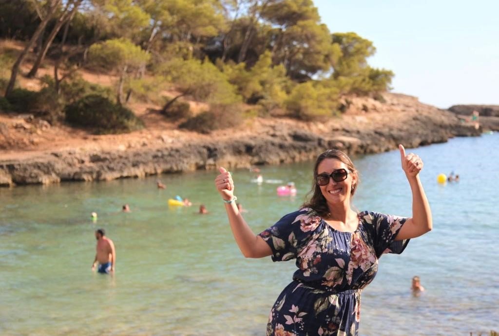 Photo of Kate Huggins next to the sea in Mallorca