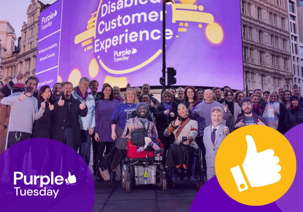 An image of the Purple Tuesday team, sponsors and ambassadors all together at the piccadilly lights celebrating Purple Tuesday and watching the piccadilly lights production. The text 