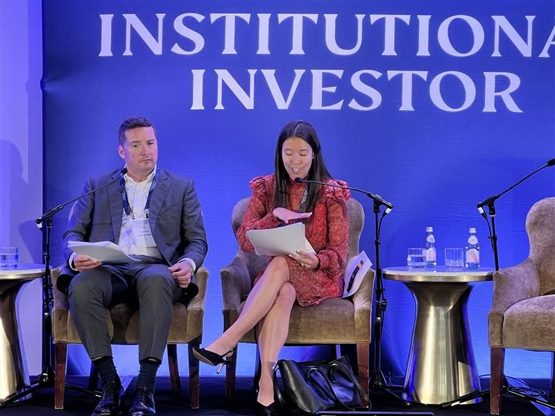 A photo of Rosie and Huw speaking at the II forum