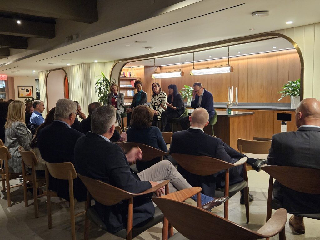 image from our latest boardtalk event - panellists speaking to an audience