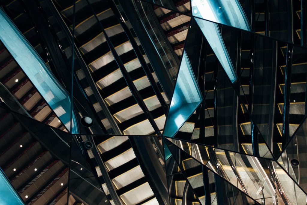 fractured mirror image reflecting city building