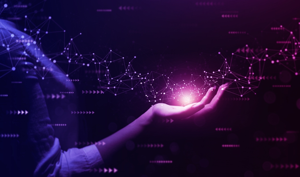 Hand holding purple light